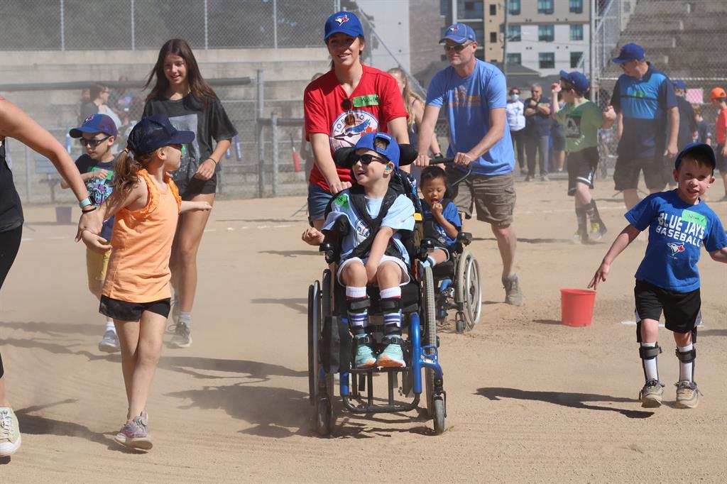 Parents and children participate in Challenger Baseball at Lancaster Park in St. Catharines